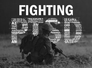 U.S. Navy Hospital Corpsman 3rd Class Sean Stevenson takes a knee while on a security patrol